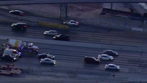 Car blocking center lane on I-15, near Spaghetti Bowl