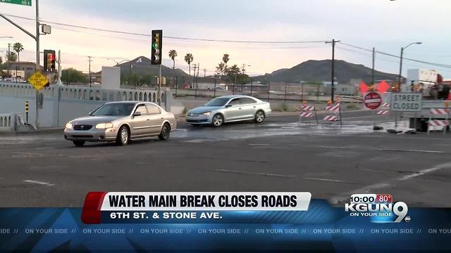 Water main break closes road