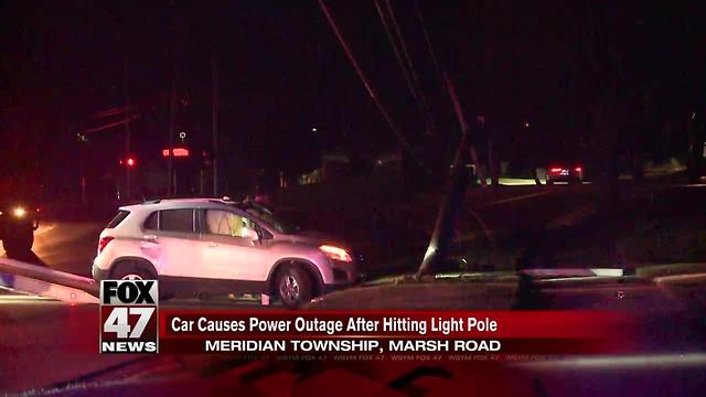 Car causes power outage after hitting light pole in Meridian Township