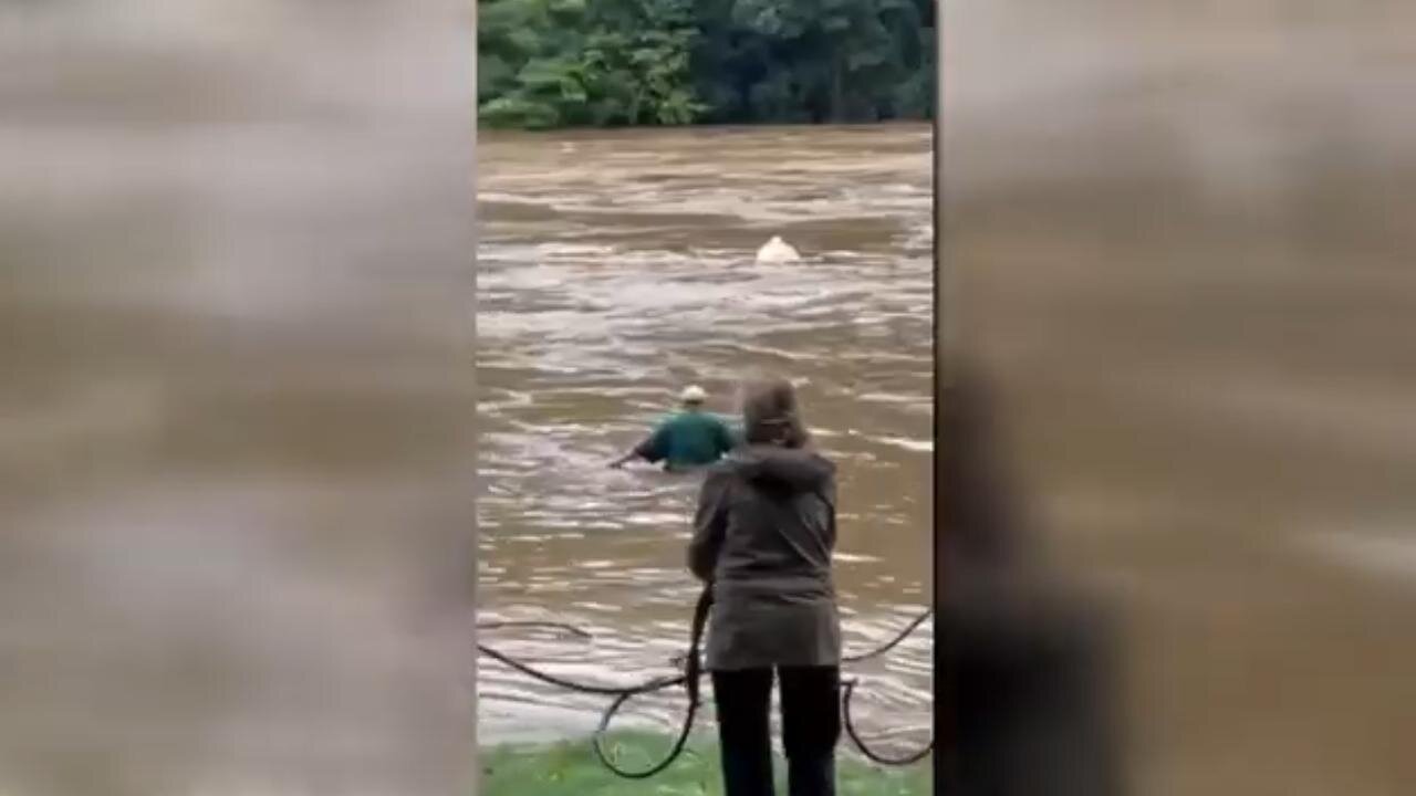 'I COULDN'T WATCH HER DIE': Man Saves Elderly Woman Trapped in House Swept Away by Floodwaters