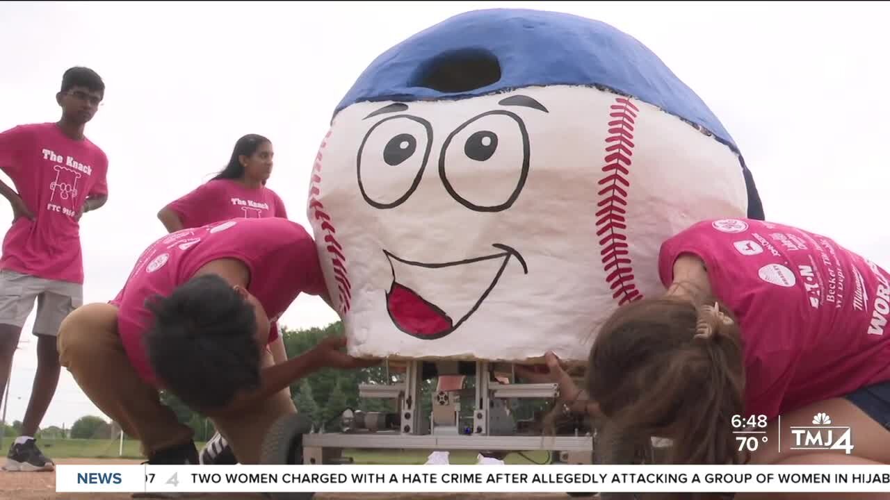 High school robotics team promotes STEM at Brewers game with first pitch