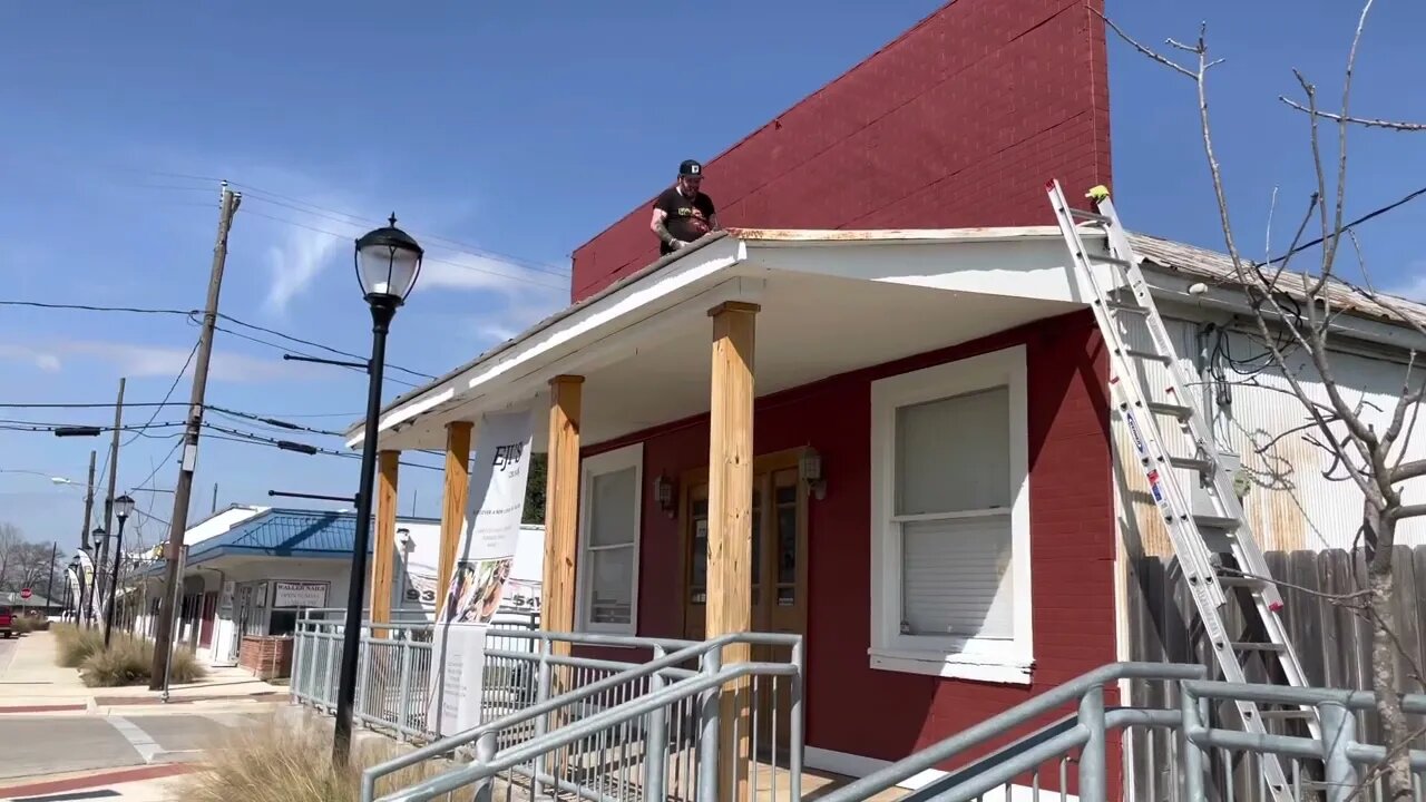 Painting New Sign for Eji’s in Waller, Texas