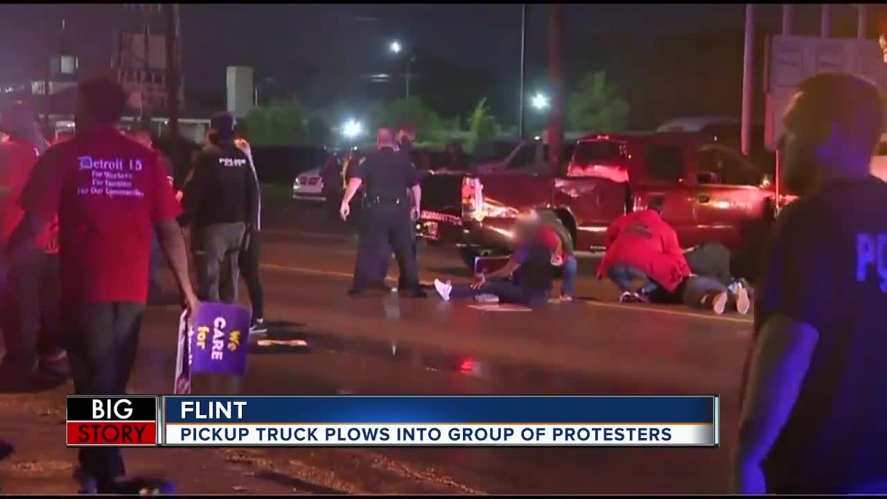 Vehicle plows into crowd of demonstrators during fast food worker strike in Flint