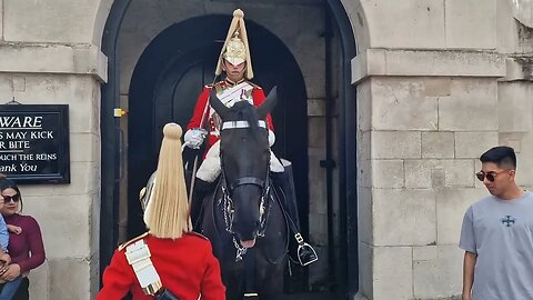 Move out of the way of the kings life guard. guard shouts at tourist in the way of other guard