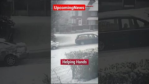 A group of strangers in England came together to help move a hearse after it got stuck in the snow.