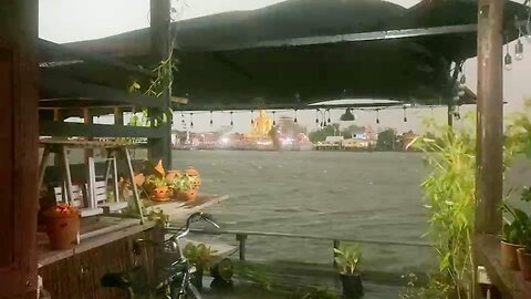 Heavy rain at Chao Phraya river Baan Hia Cafe Koh Kret Thailand