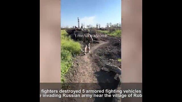 Ukrainian soldiers show the column of Russian equipment which they destroyed in Zaporizhzhia