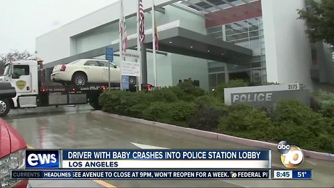Driver with baby crashes into police station lobby.