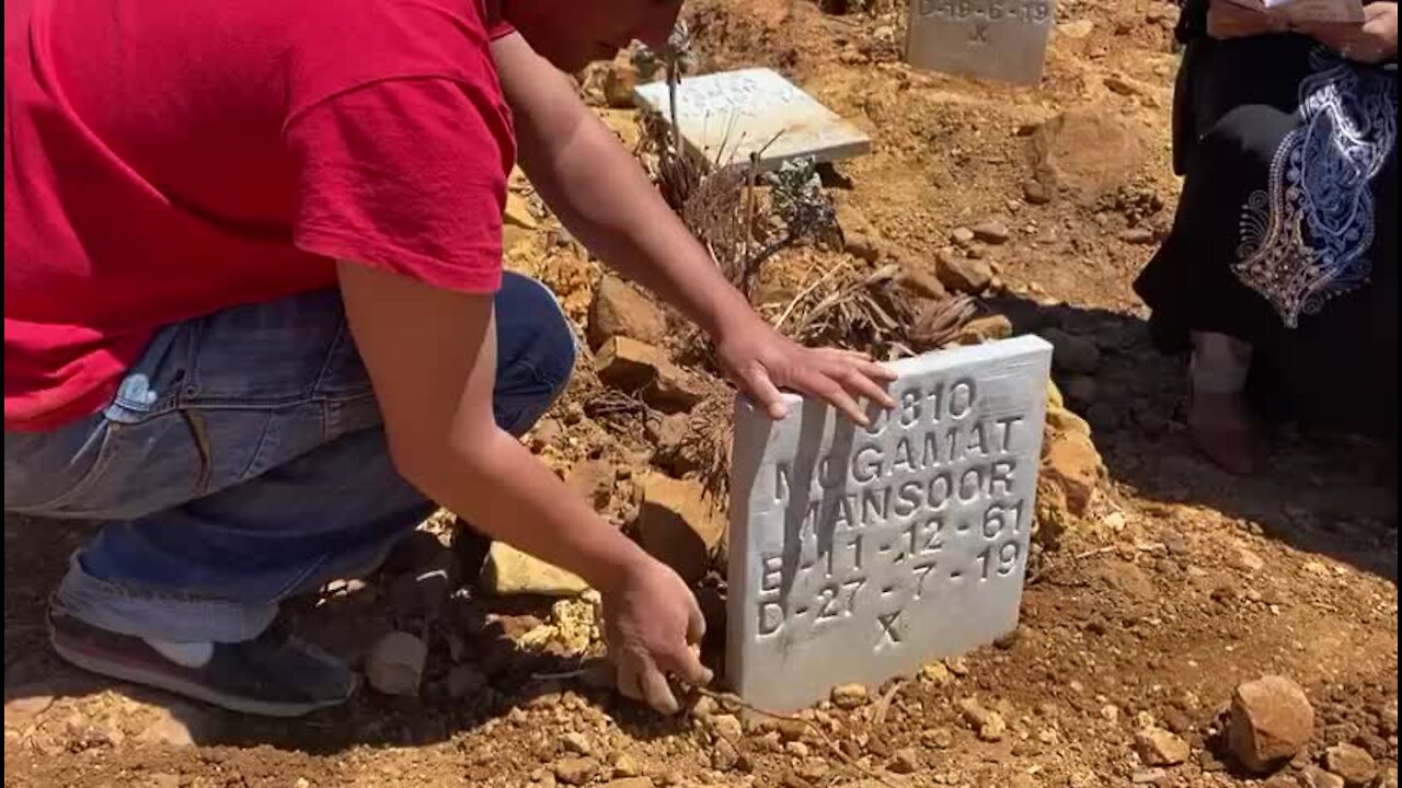 South Africa - Cape Town - Families replant headstones and neaten graves (Video) (s6z)