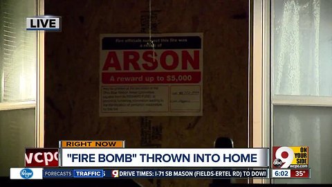 Police looking for suspect who threw 'fire bomb' into home