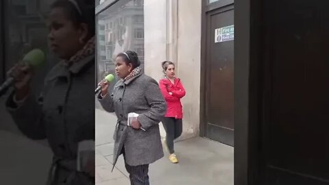 Sister Fathia preaching the Gospel in Oxford Circus, London.