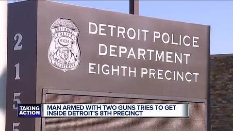 Man brandishing two guns tries to get into police precinct, woman drives him to hospital for help