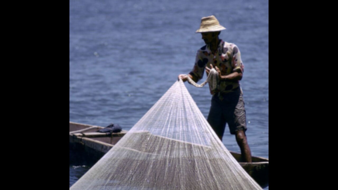 Fishing by net in small river