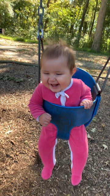 Baby Girl Can't Stop Giggling During First Ever Swing Ride