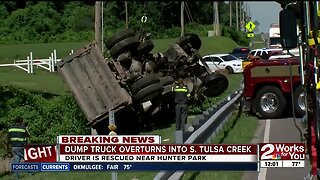 Dump truck overturns in Hunter Park creek