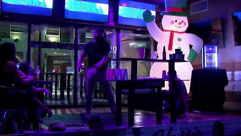 Bottle slinging bartenders show off skills to help sick man