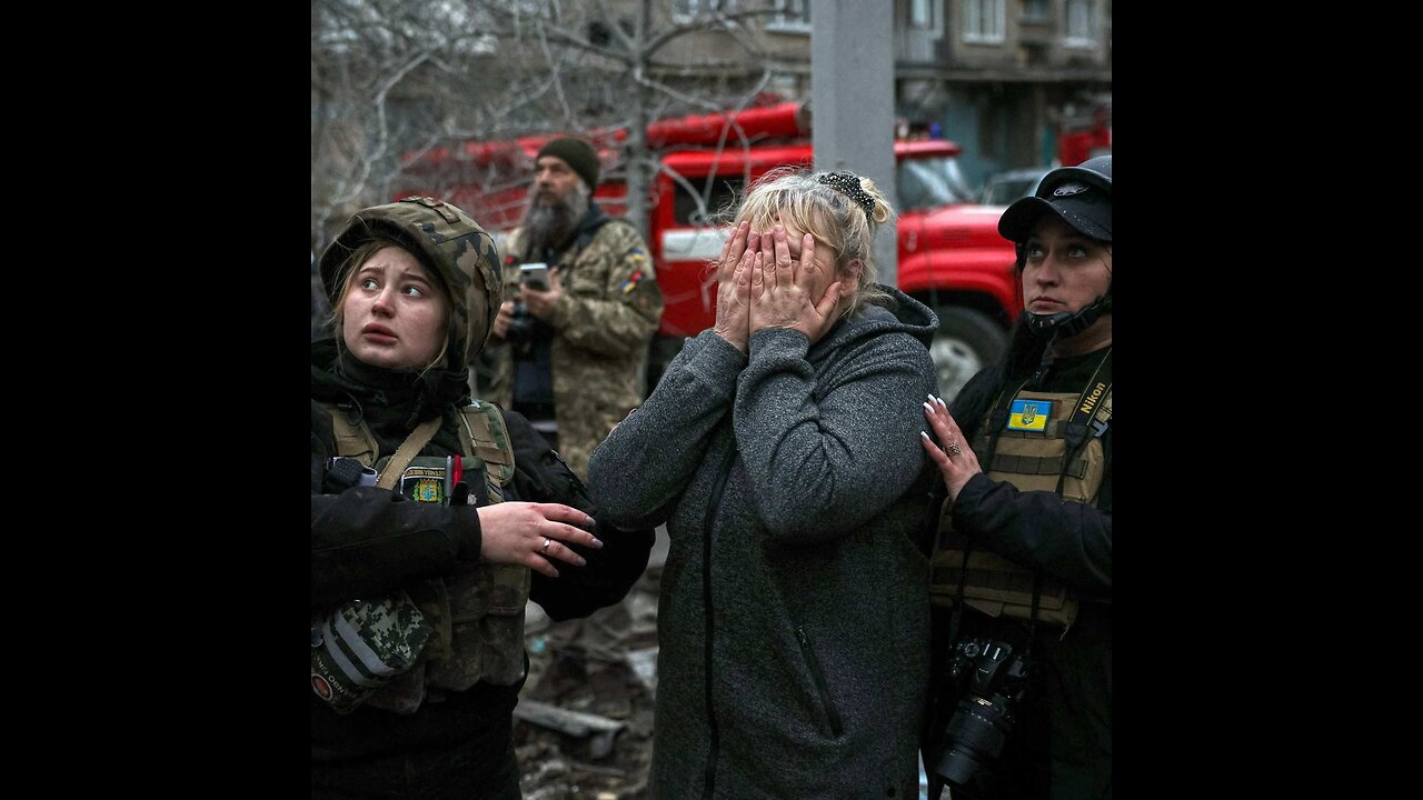 Russians whose house caught fire after a missile strike, seek to save their belongings