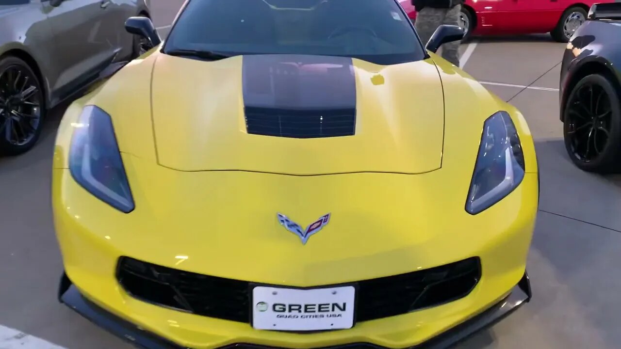 My son and I checking out some corvettes for sale.