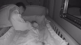 Loving big brother caught on camera taking care of baby sister