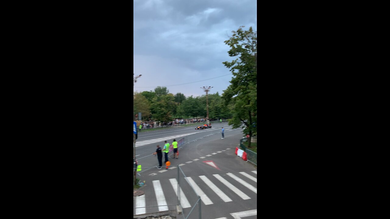 Red Bull RB7 V8 F1 car tearing up the streets of Bucharest