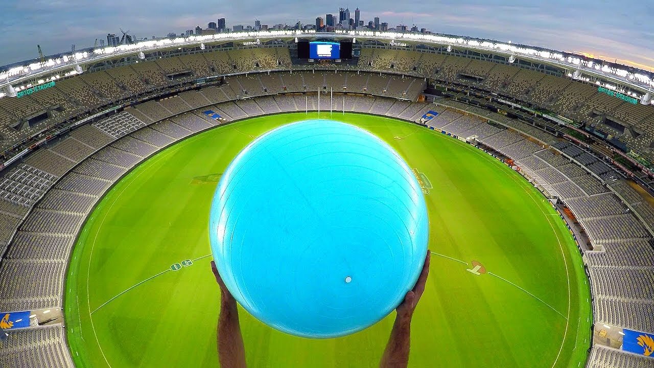 CATCHING EXERCISE BALLS with MAGNUS EFFECT from STADIUM ROOF!