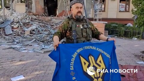 Commander of LPR militia Cossack regiment showed captured banners of Ukrainian units