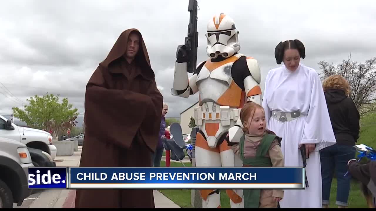 Superheroes march to prevent child abuse