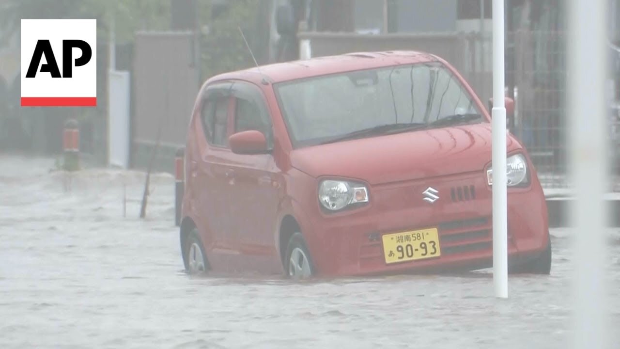 Heavy rain floods roads and disrupts transport in Japan.