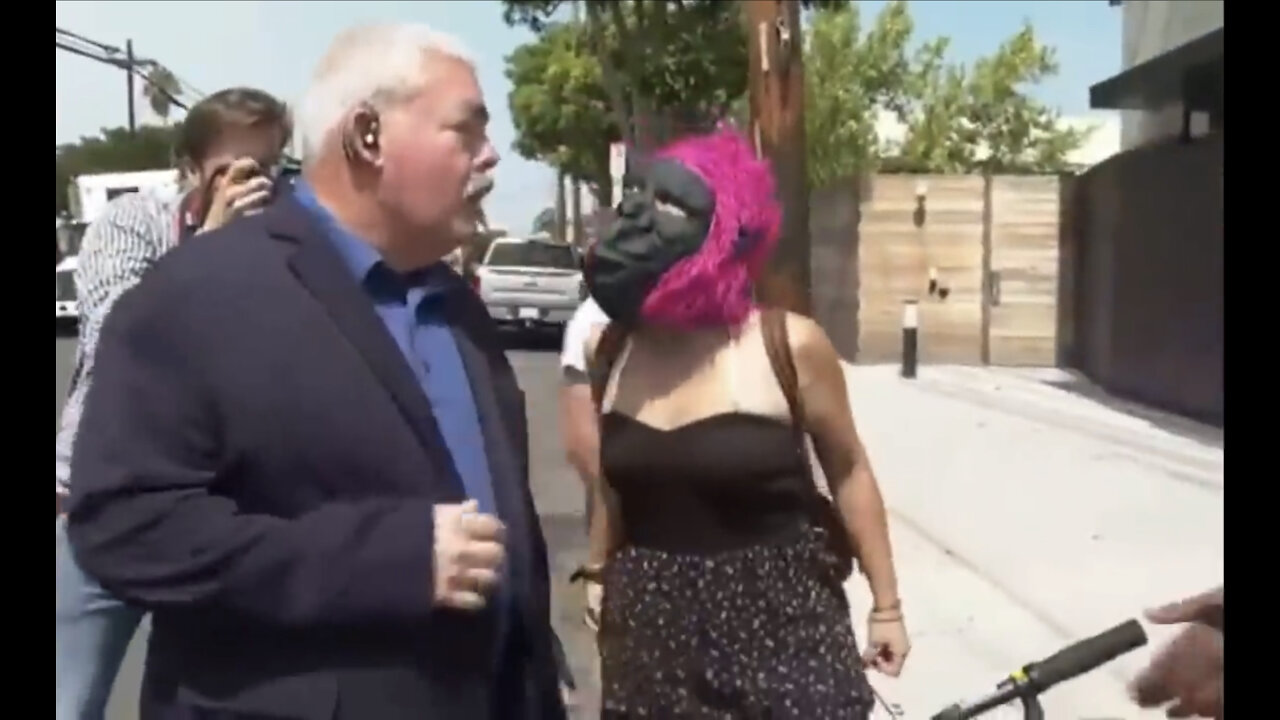 Unhinged White Liberal Democrat Wearing Gorilla Mask throws egg at Larry Elder