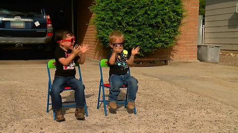 Tucson boys wait for the garbage truck