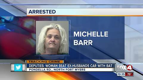 Woman beats ex husbands car with bat