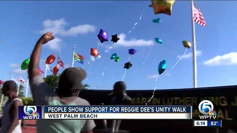 People show support for Reggie Dee's unity walk