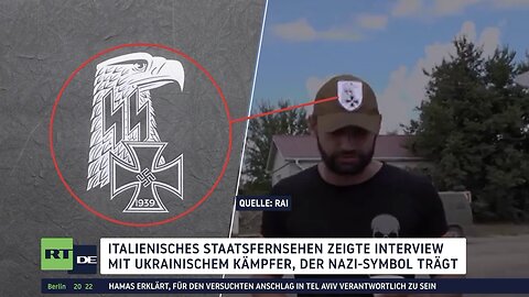 Ukrainischer Kämpfer trägt Nazi-Symbole während eines Interviews