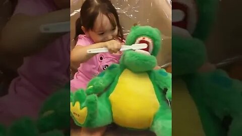 Tasha Brushes the Alligator's Teeth