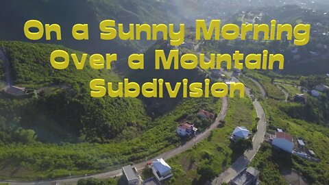 Droning on a Sunny Morning over a Mountain Subdivision