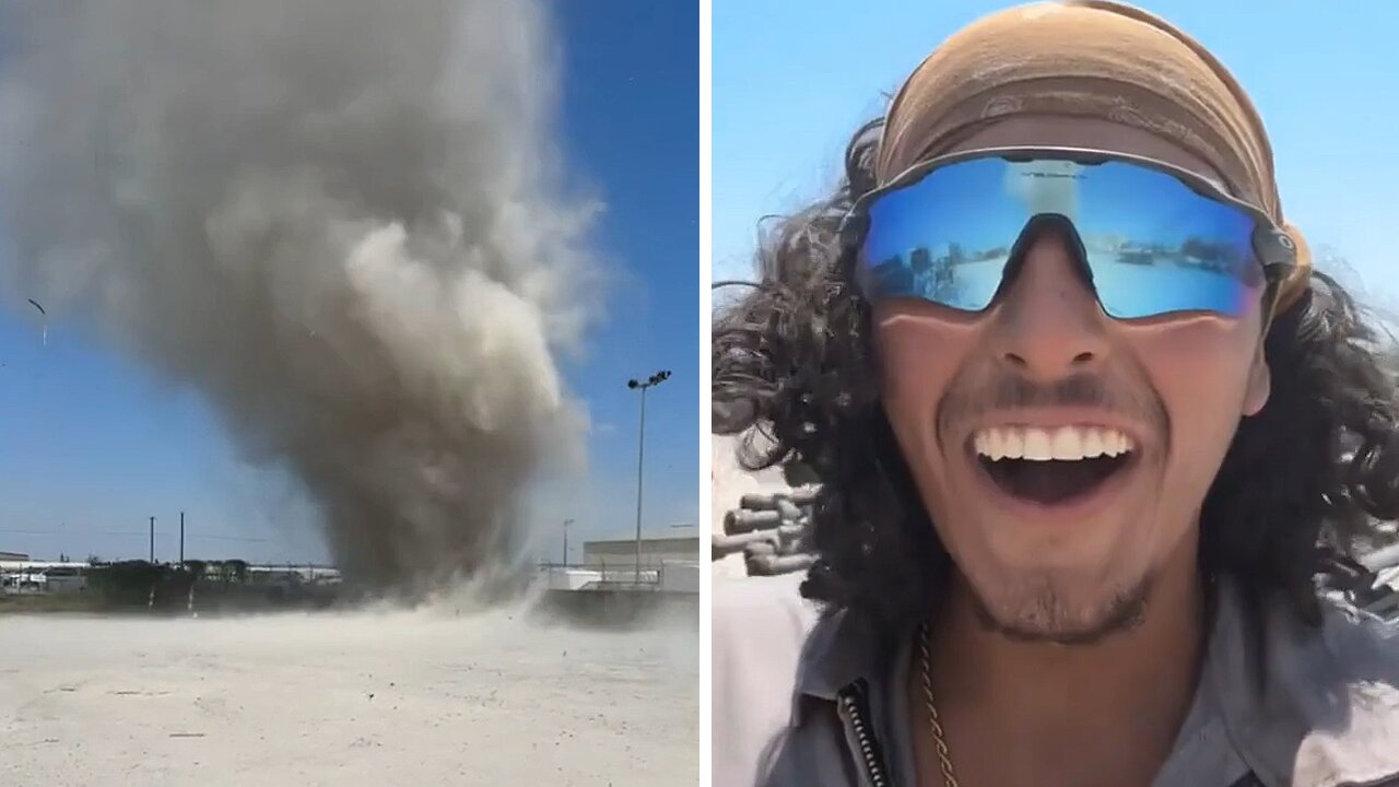 Brave man stands firm in the face of an unexpected dust devil