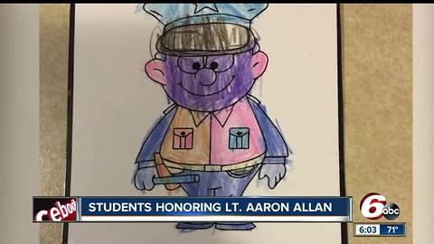 Students honored Lt. Allan with notes on officer cruisers during funeral service