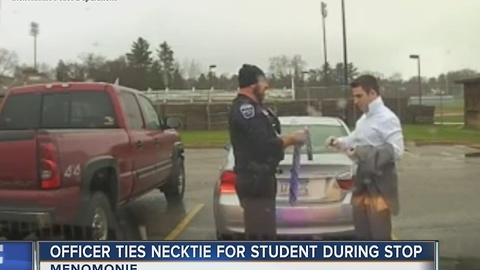 Officer ties necktie for student during traffic stop