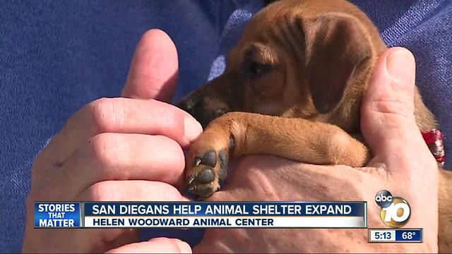 Puppy kisses spark smiles as the Helen Woodward Animal Center expands