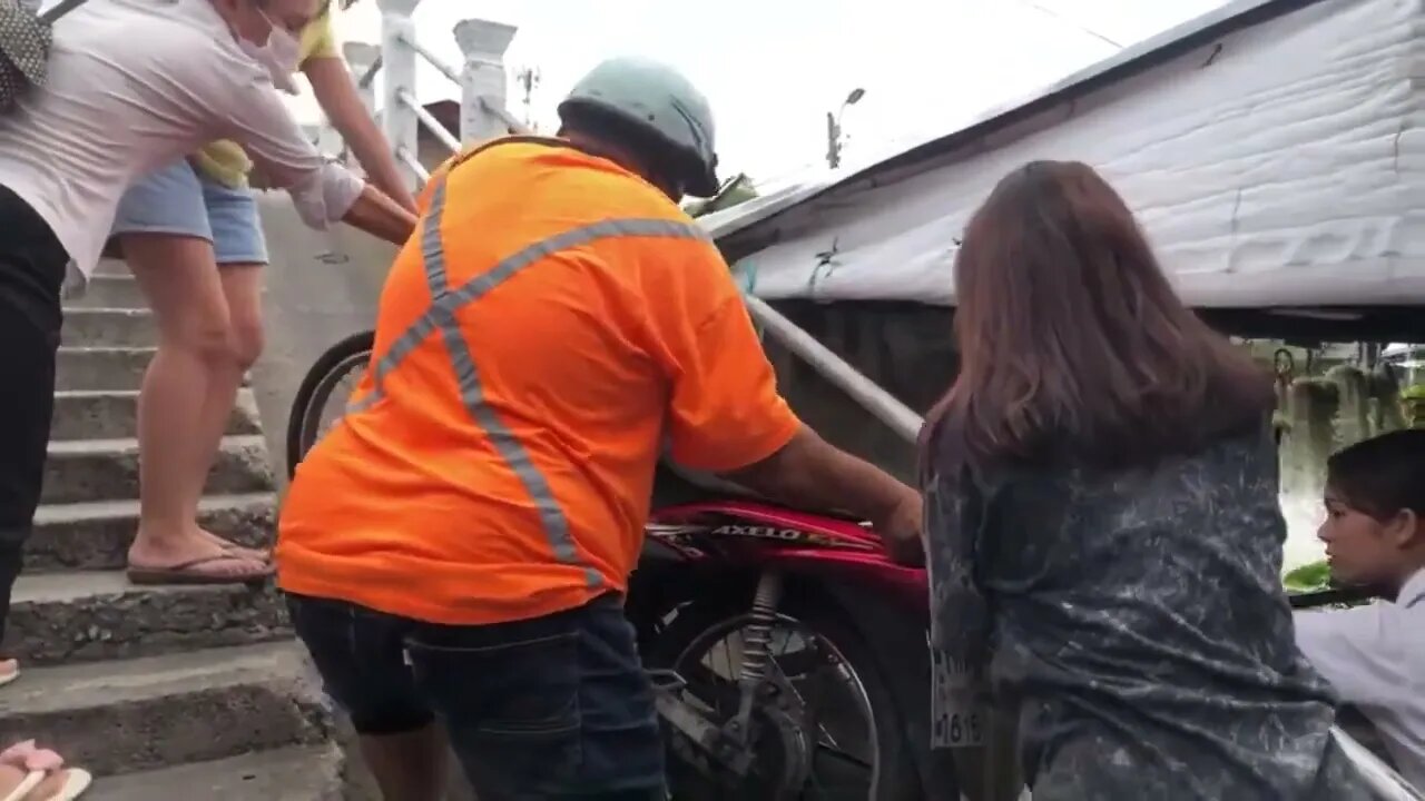 Khlong Bang Luang's Tranquil Beauty Interrupted: Motorcycle Mishap on the Serene Bridge