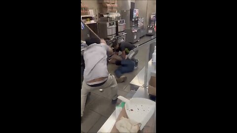 Guy goes around counter and is confronted by the workers