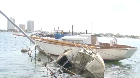 Organization works to remove sunken boats