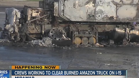 Crews working to clear burned Amazon truck on I-15