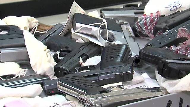 Cleveland police show off dozens of guns taken off of streets