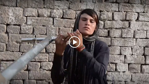 An Afghan woman forced to dress as a man