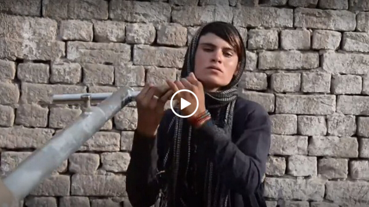 An Afghan woman forced to dress as a man