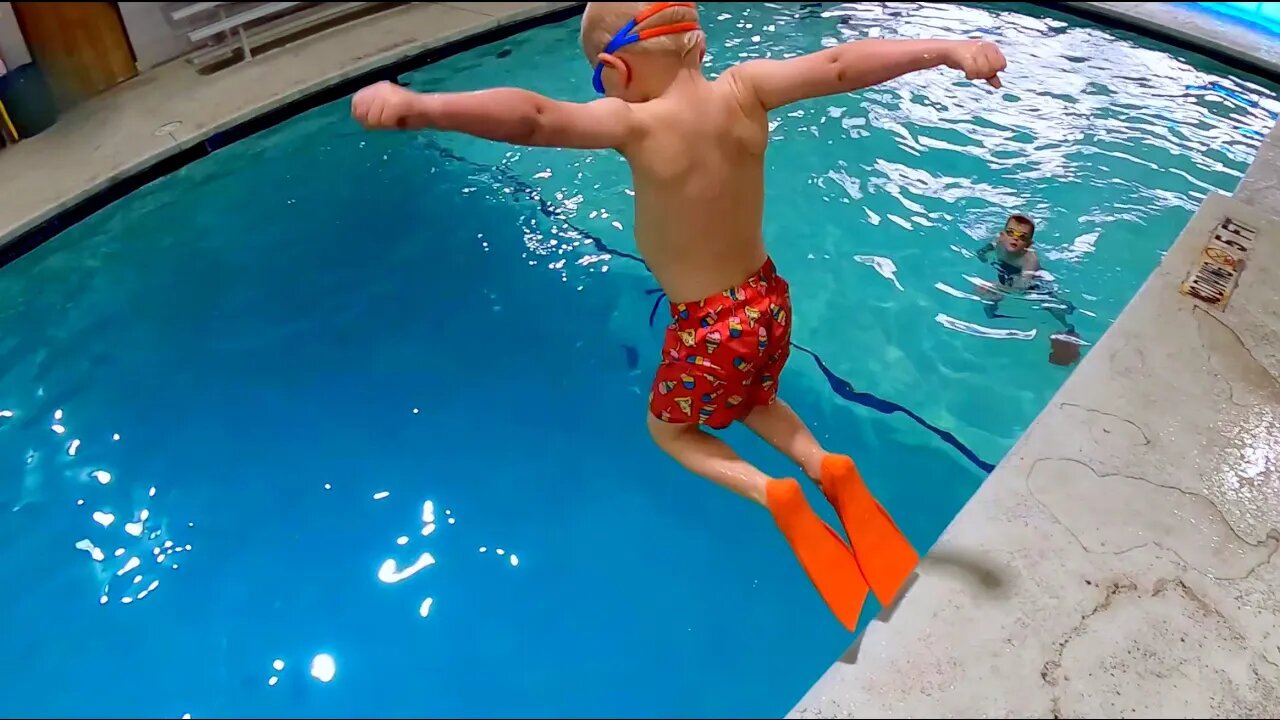 Cute Kids Jumping into the Pool at Scuba Adventure