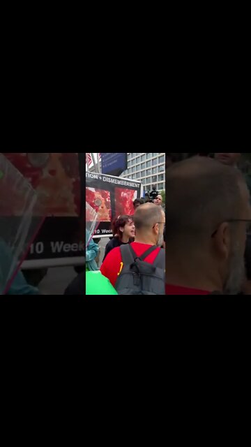 Pro-Abortion protester screaming "We Love Killing Babies"