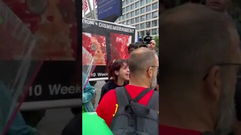 Pro-Abortion protester screaming "We Love Killing Babies"