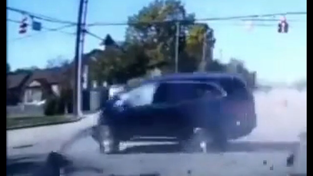 Someone Ran A Red Light & A Pedestrian's Life Was Saved By An SUV